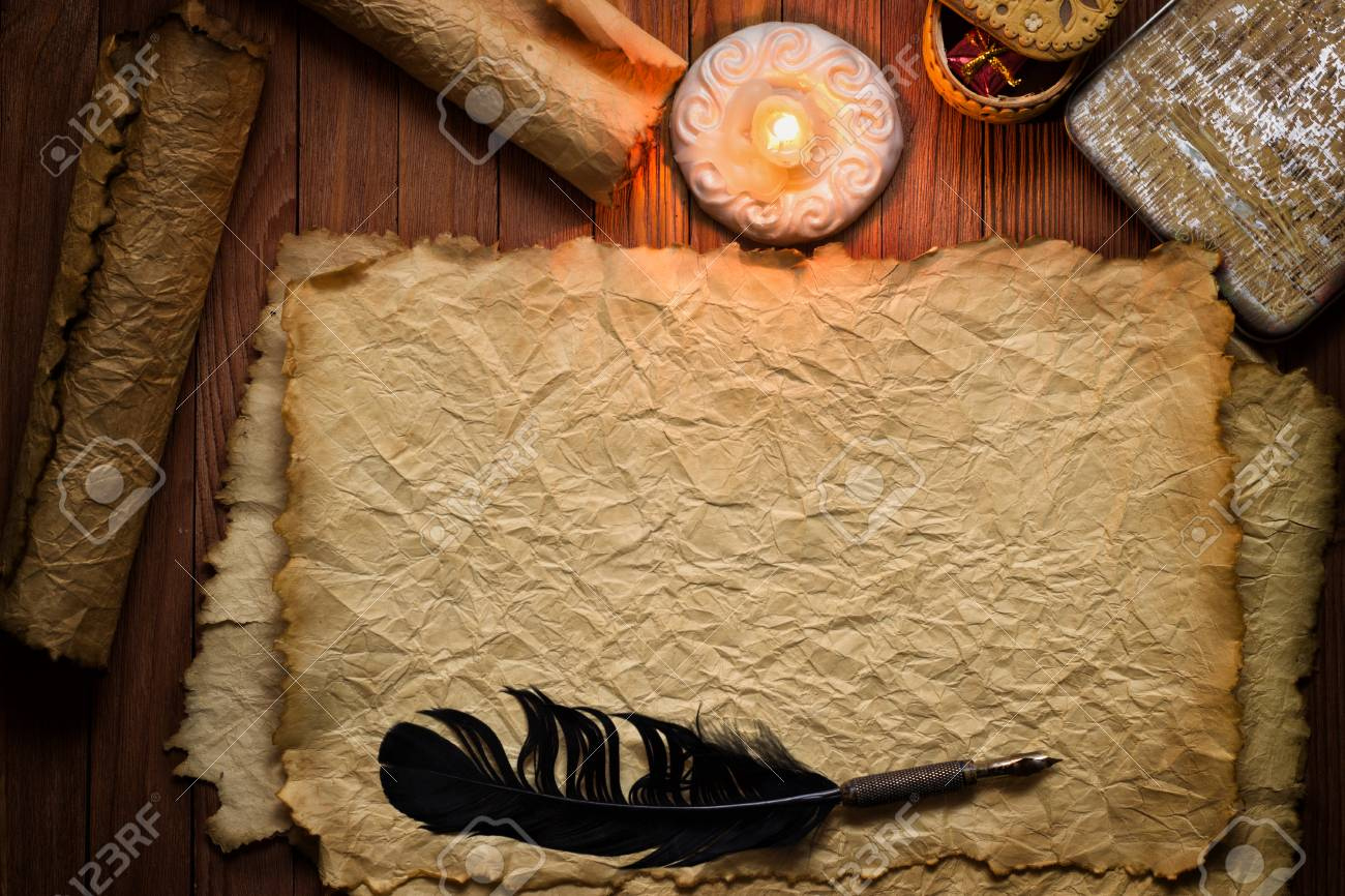 Ancient Papyrus Paper With Feather And Candle On Wood Table with Feather And Papyrus Template